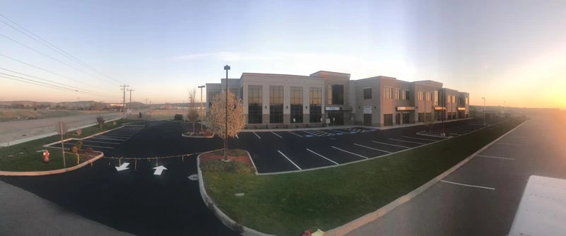 Complete Commercial Parking Lot Sealcoating and Striping at Sunset