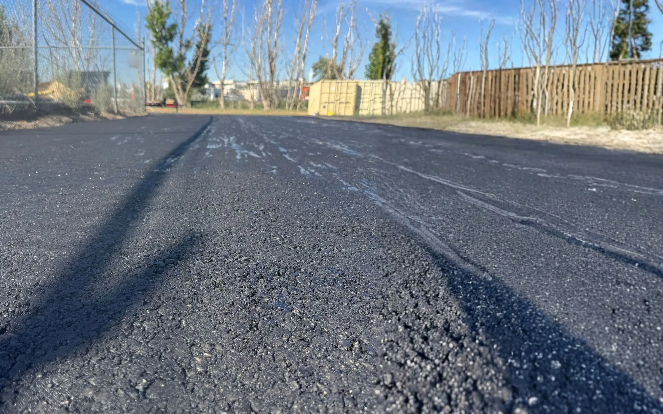 Sealcoating – Freshly Sealed Asphalt Surface in Idaho