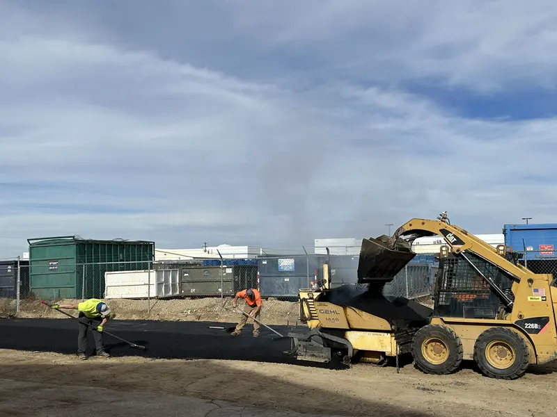 CAT Skid Steer Loader Handling Asphalt Commercial Project