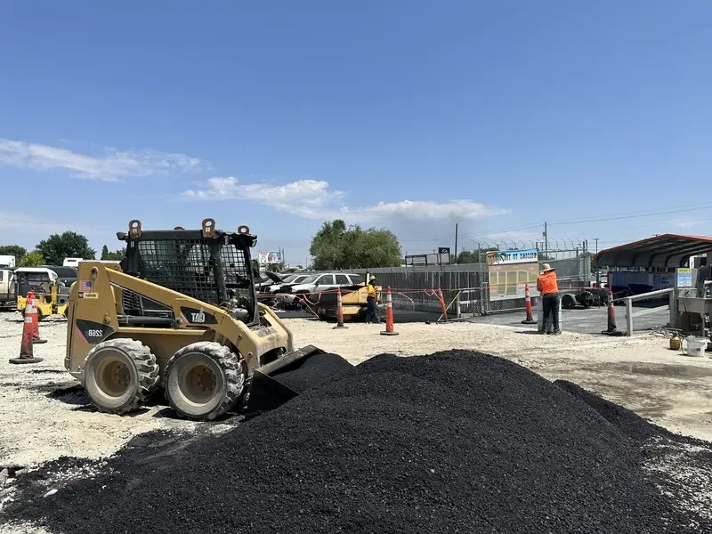Paving Crew Operating Gehl Paver and CAT Loader