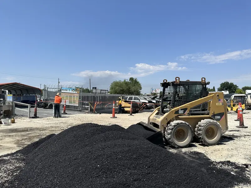 Paving Crew Operating Gehl Paver and CAT Loader