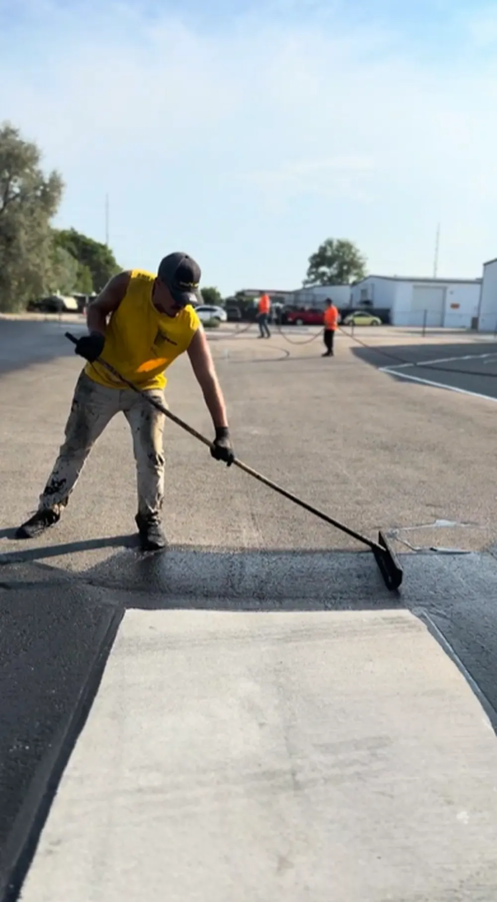 Superior Striping Full Crew Applying Asphalt Sealcoating on Large Commercial Parking Lot in Nampa ID