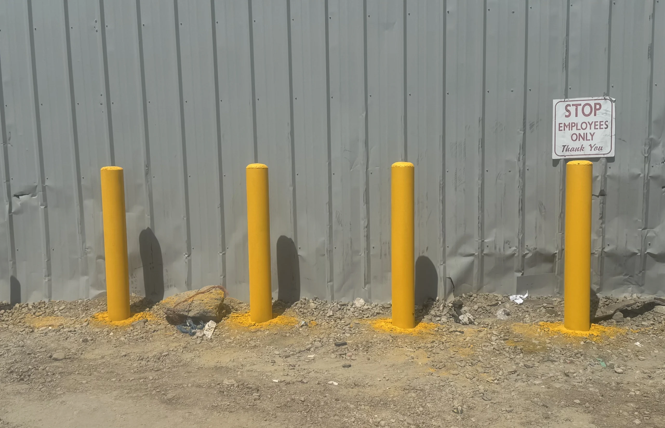 Yellow Steel Bollards for Industrial Building Protection in Treasure Valley