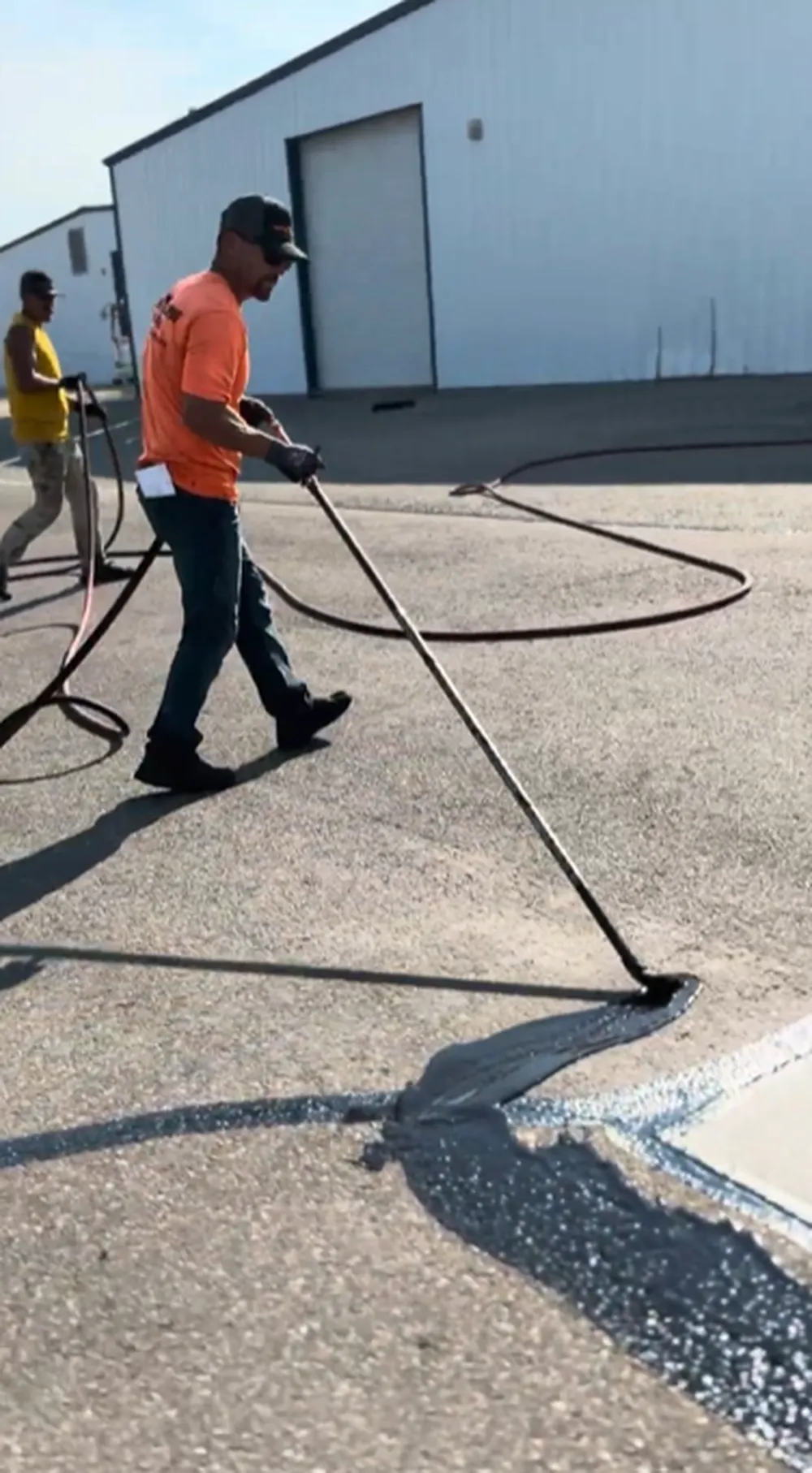 Superior Striping Crew Applying Sealcoat to Commercial Parking Lot in Nampa, Idaho