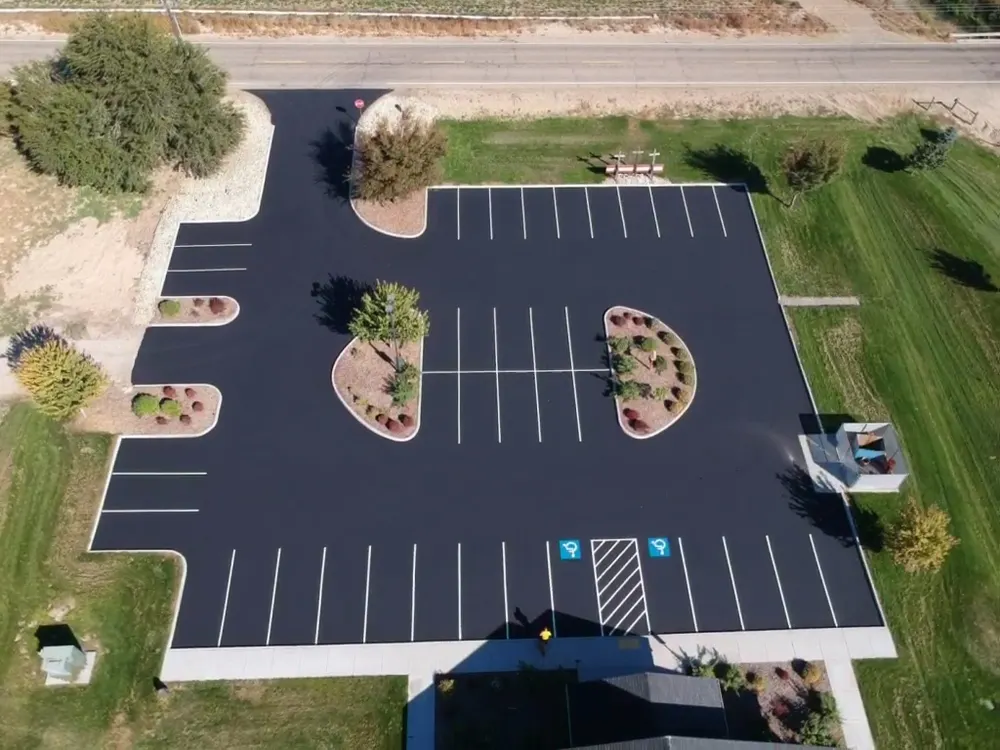 Fresh sealcoating and line striping completed by Superior Striping in Idaho commercial parking lot