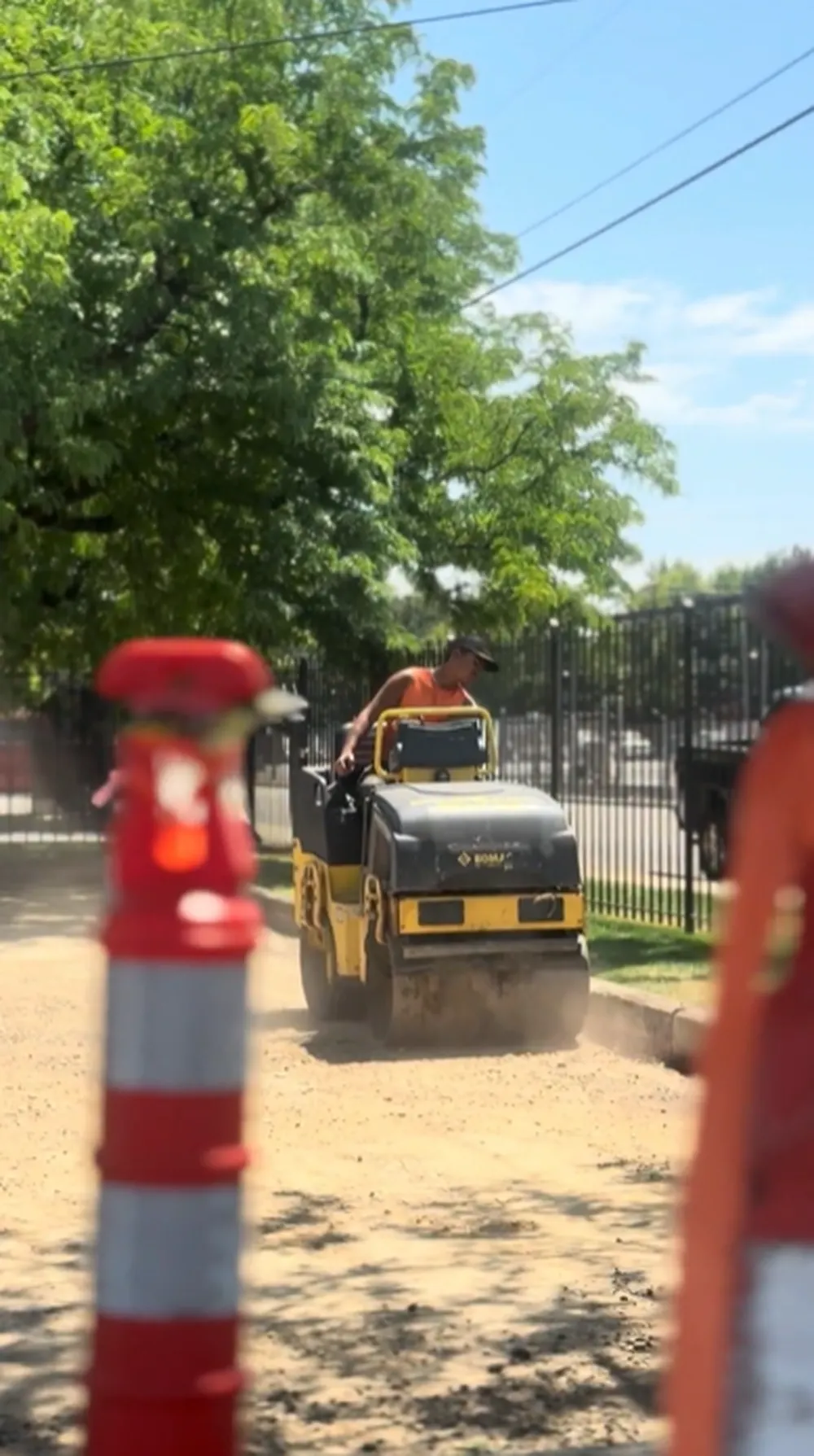 Superior Striping Crew Member Operating Bomag Roller Compactor in Boise, Idaho