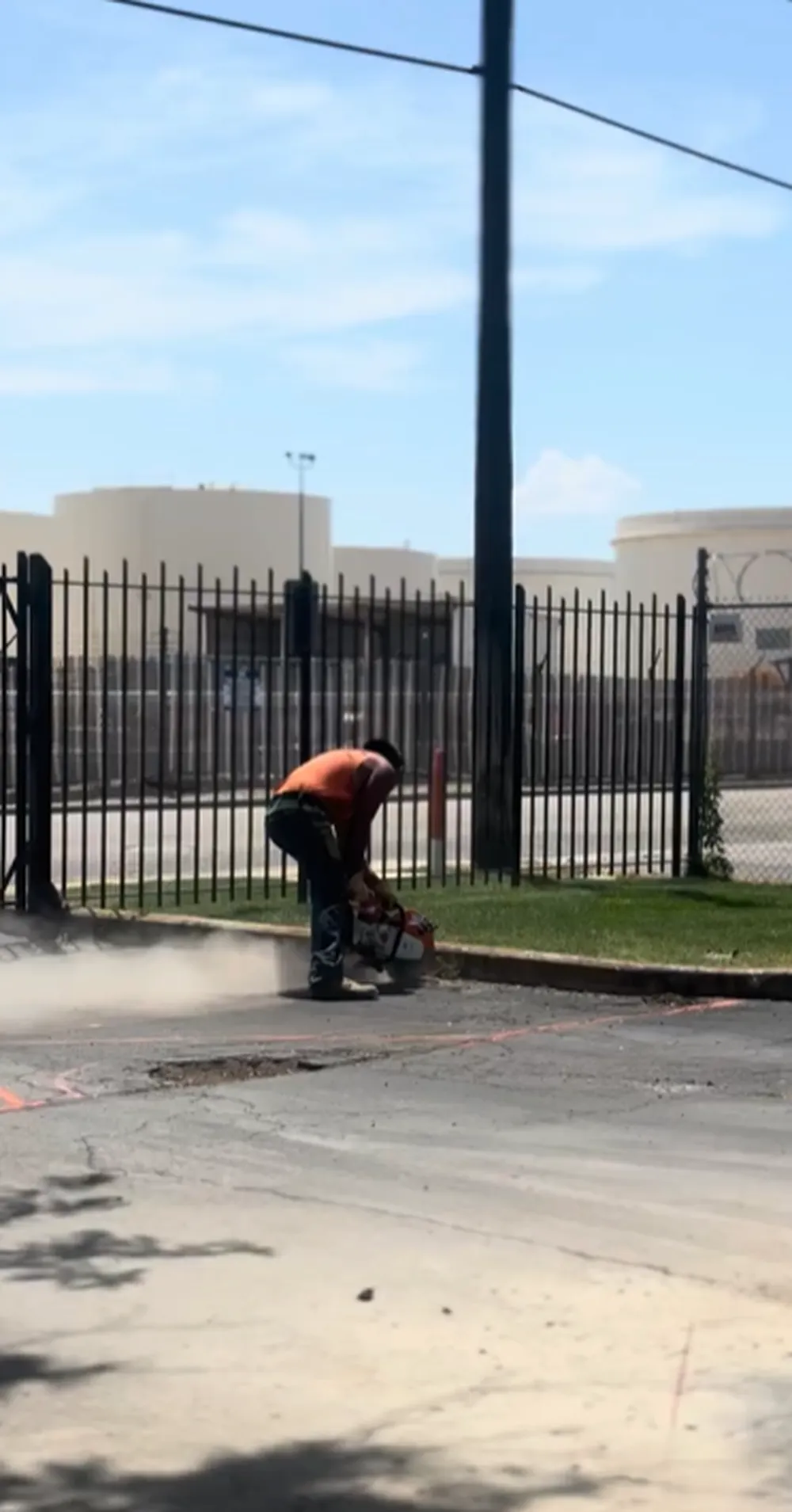 Superior Striping Crew Member Cutting Asphalt with Saw in Boise, Idaho