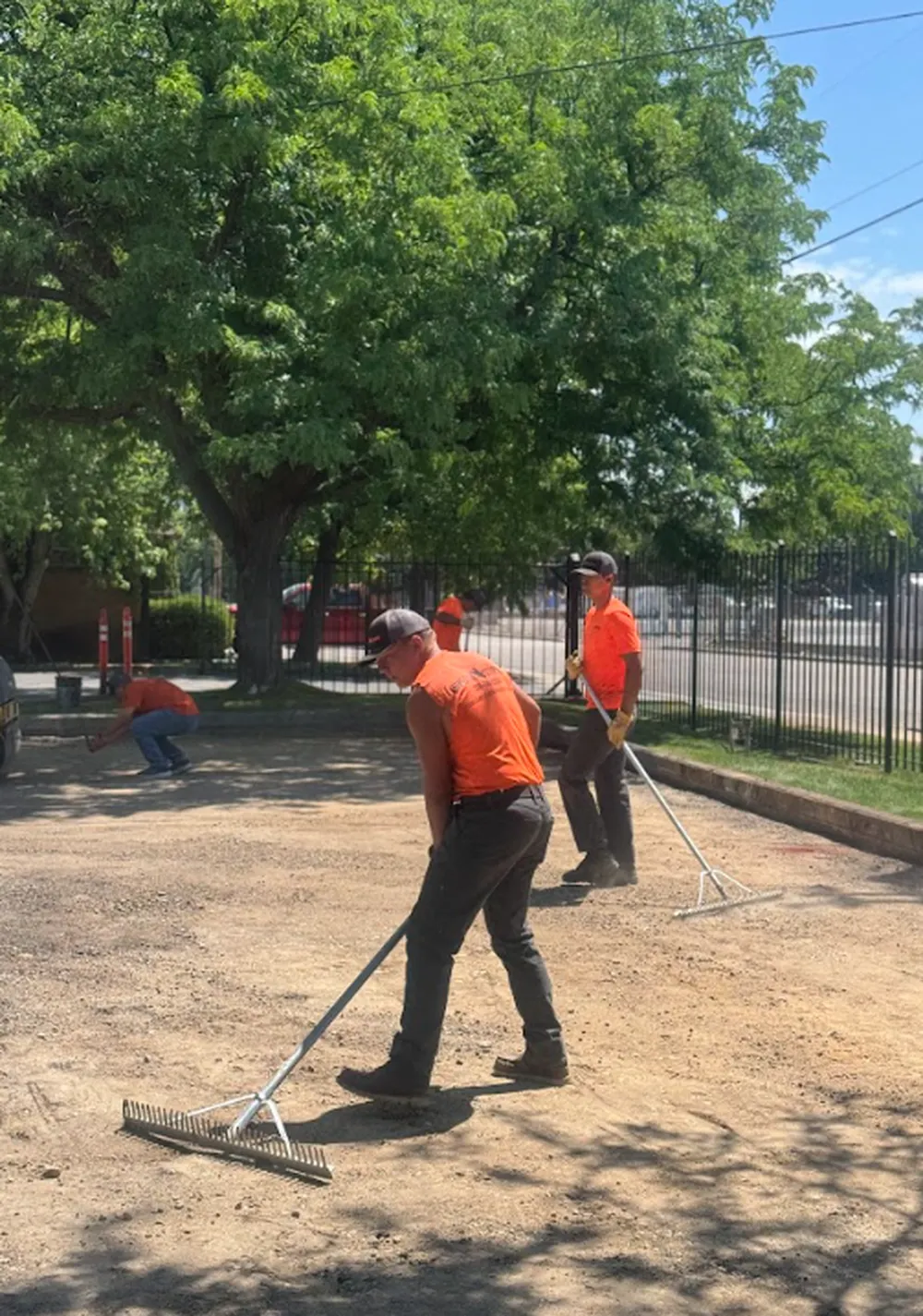 Superior Striping Crew Raking and Leveling Gravel Surface in Boise, Idaho