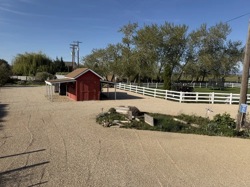 Gravel Installation Around Outbuildings and Fencing in Meridian